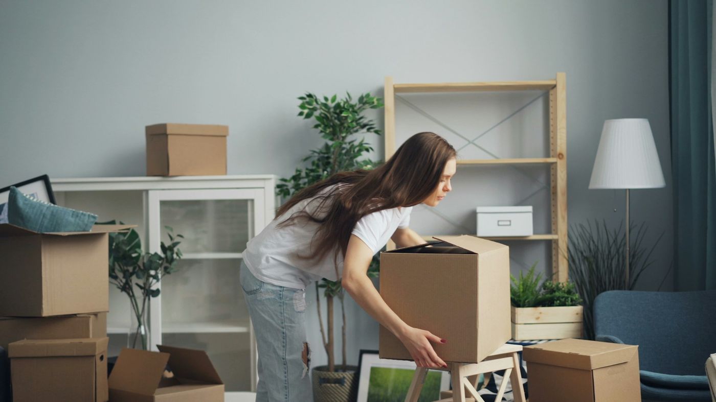 Small crew loading furniture into a single truck