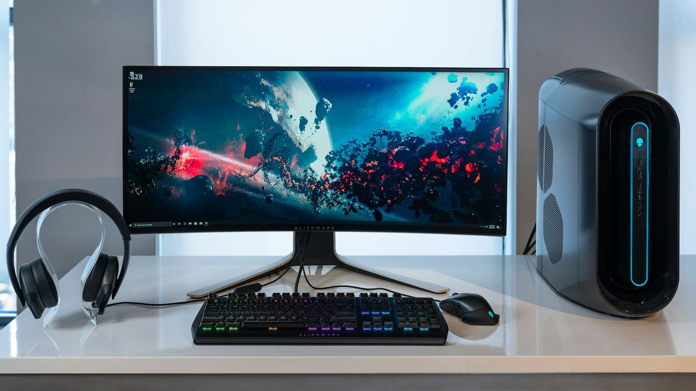 A modern technology workspace with monitors and professional electronics