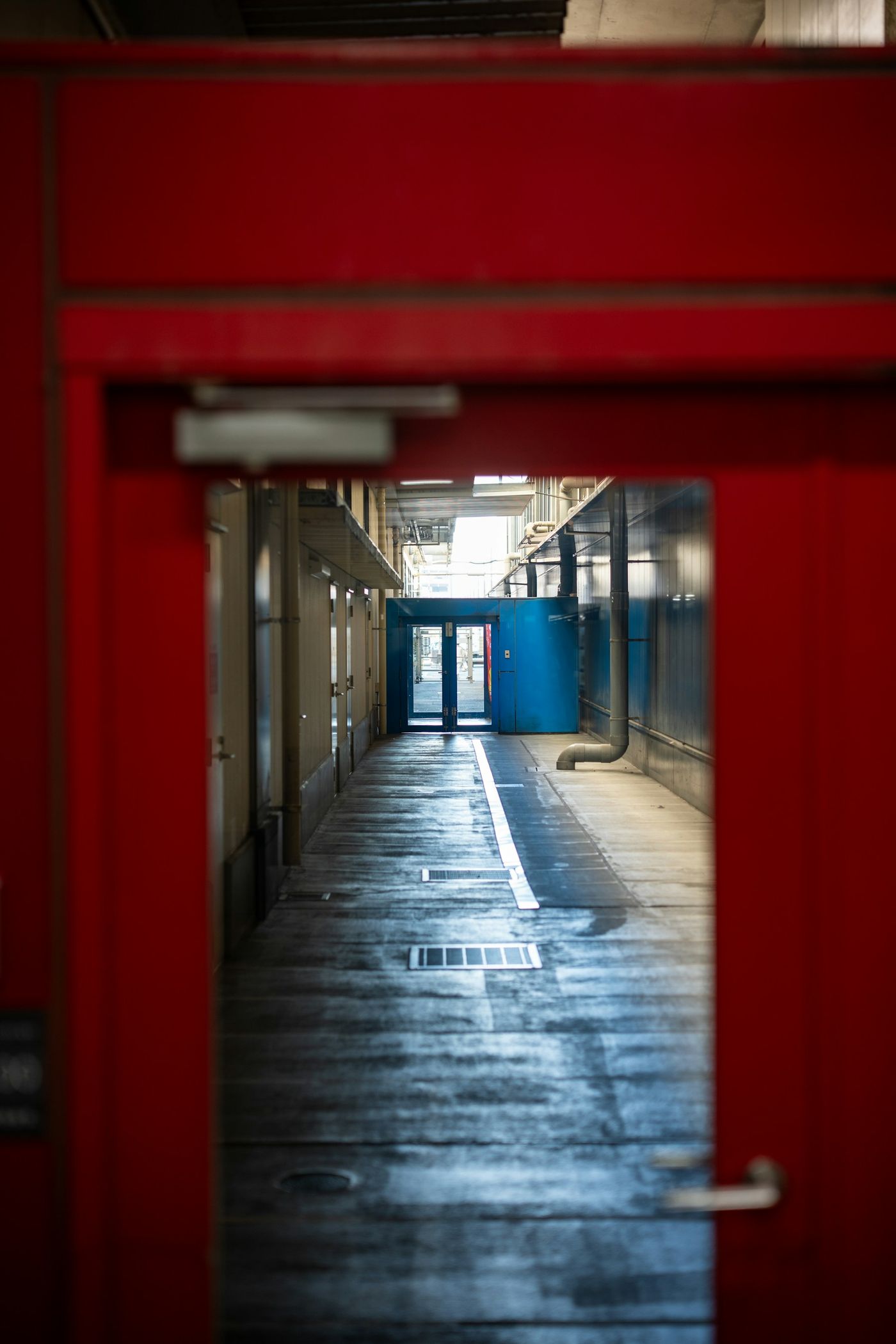 A modern, well-lit storage facility corridor